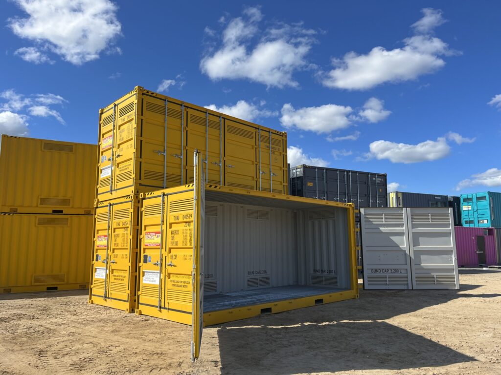 Open shipping container with ventilation panels and capacity markings, set outdo