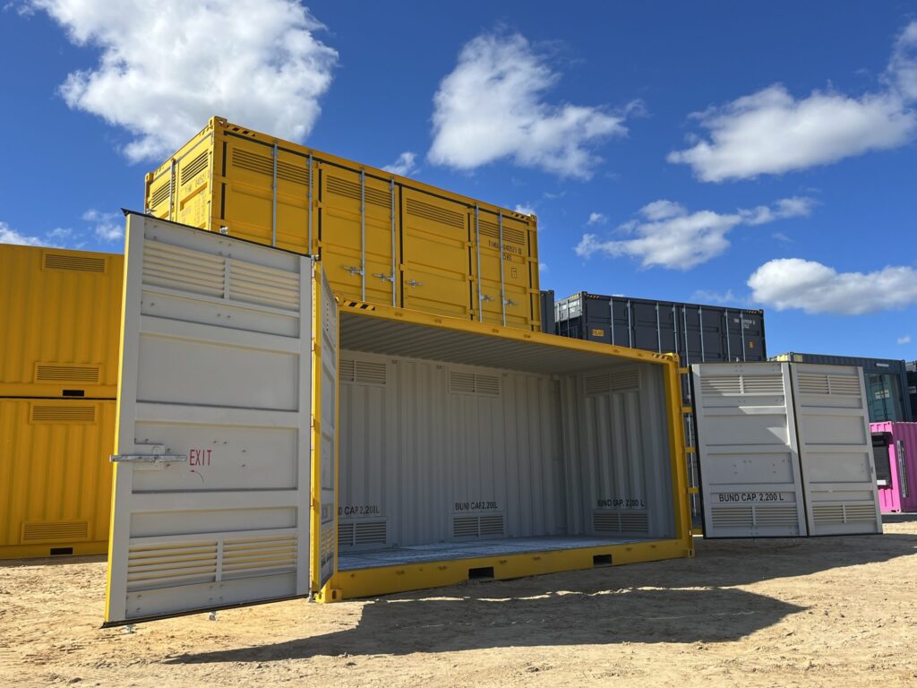 Partially open yellow container with 'Exit' label, showcasing industrial design.