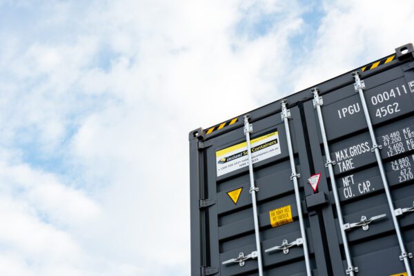 Close-up of a new shipping container with Instant Sea Containers branding, showing container specifications and high-quality build for hire or sale in Western Australia